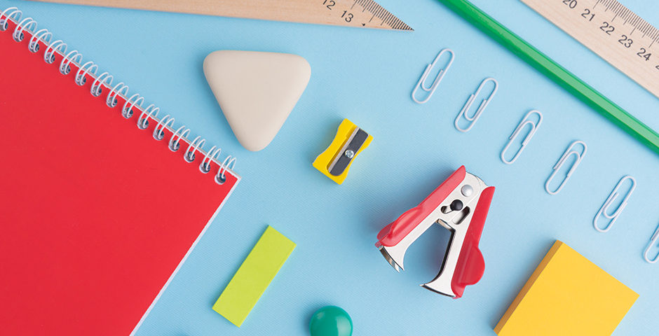 Office supplies on the blue background table